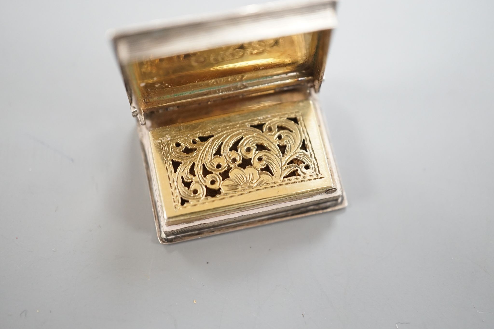 An early Victorian novelty silver vinaigrette, modelled as a book, Taylor & Perry, Birmingham, 1838, 26mm.